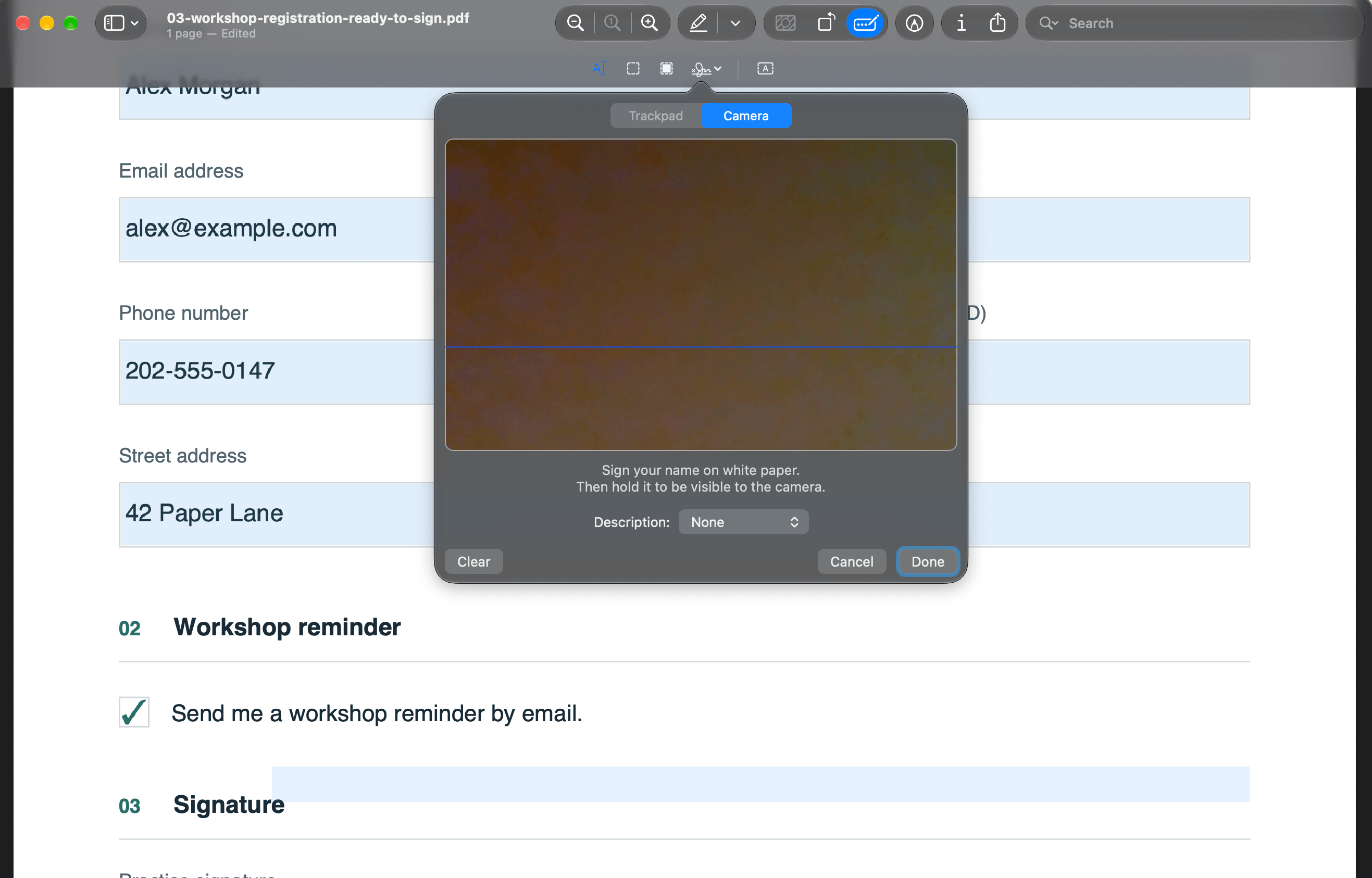 Preview’s signature capture window with Camera selected and instructions to hold a signature written on white paper up to the camera.